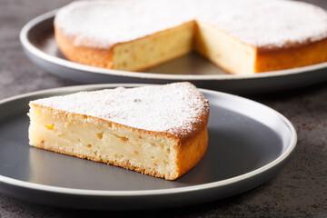 Easy Yogurt Cake, a simple easy and delicious Snack or Dessert Cake closeup in a plate on a table. Horizontal