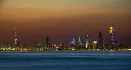 Sunset Sunrise and Blue Hours in 
Liberation Tower Kuwait City Scape Landscape Panorama with a light in the Building.