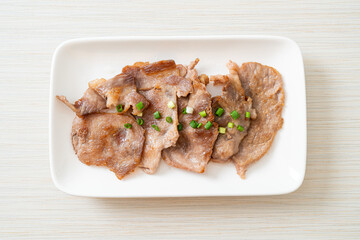 grilled pork neck sliced on plate