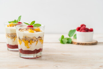 homemade mango and raspberry with yogurt and granola