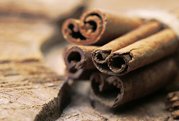 Cinnamon sticks on a wooden background