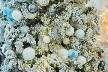 Fototapeta na wymiar Elegant decorated with balls and figures Christmas tree