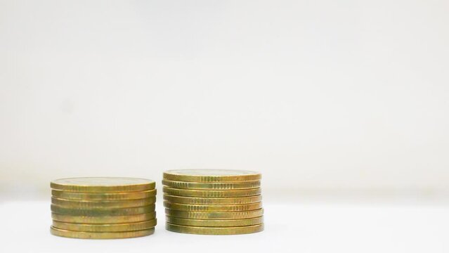 Stop motion footage coin decrease and increase business concept.