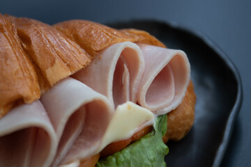 Close up Ham and Cheese Croissant on Black background