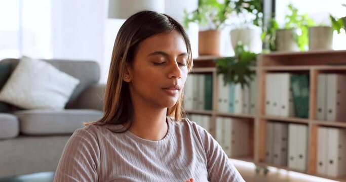 Woman, yoga and meditation for mental health, wellness and spiritual wellbeing in breathing exercise at home. Female in peaceful, calm and relax meditating for zen, healthy mind and awareness indoors