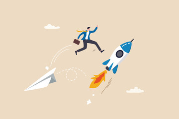 Change to better company, innovation to help success or career change to new path, alternative way or direction concept, ambitious businessman jump from old origami airplane to growing up rocket.