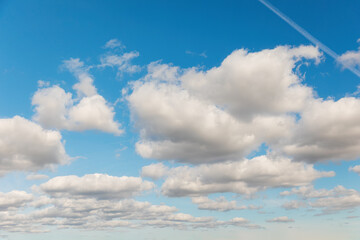 Fototapeta premium Blue sky with clouds. Horizon. Azure heaven with cloudscape with copy space. Concept of freedom and heaven