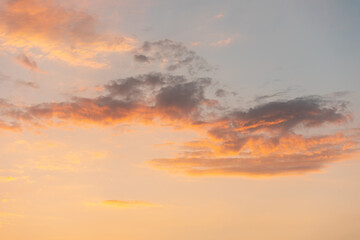 Golden sunrise in the sky with clouds. Copy space. Scenic abstract background