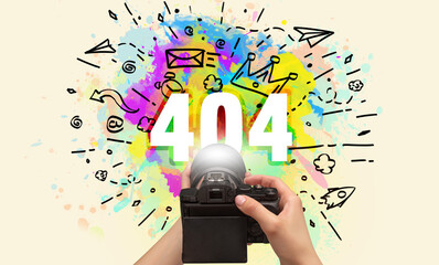 Close-up of a hand holding digital camera with abstract drawing