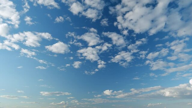 Tropical summer sunlight. Blue sky with cirrocumulus and cumulus on different layers clouds. Fluffy layered clouds sky atmosphere. Timelapse.