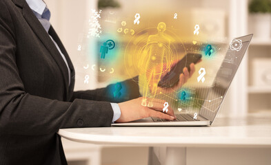 Doctor working on laptop with healthcare concept