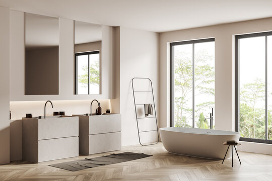 Corner view on bright bathroom interior with bathtub, panoramic windows