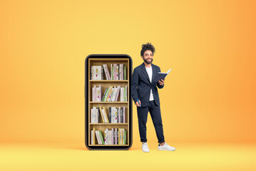 Arab businessman with notebook in hand, smartphone with digital library