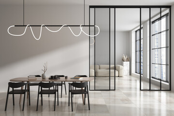 Light meeting room interior with eating table and couch, panoramic window