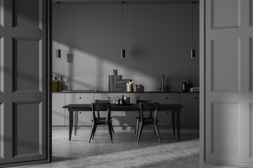 Grey kitchen interior with dining and cooking area, decor and kitchenware