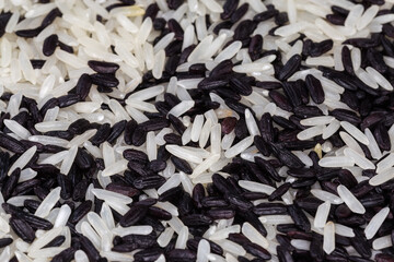 Raw black and white rice mixture, close-up, selective focus