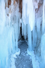 Inside the turquoise ice cave - ice cave winter frozen nature background landscape - Lake Baikal, Siberia, Eastern Russia
