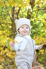 little girl in in autumn park