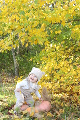 little girl in in autumn park