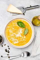 Butternut soup o risotto with pumpkin seeds, with basil and olive oil. seasonal fall menu