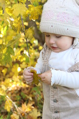 little girl in in autumn park