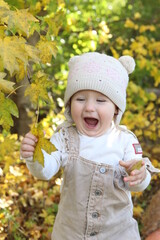 little girl in in autumn park