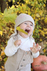 little girl in in autumn park