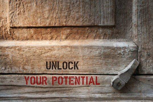 Old Locked Door With Text  UNLOCK YOUR POTENTIAL ,concept Of Unfold Unleash Talents, To Remind Someone They Capable To Do More, Just Think Less Act More And Take Action To Put Dreams Into Reality