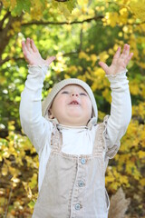 little girl in in autumn park