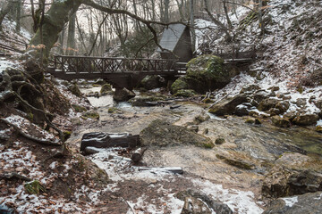 Bridge over the river Ulu-Uzen next Djur-Djur waterfall in early spring. Khapkhalskiy canyon in Crimea