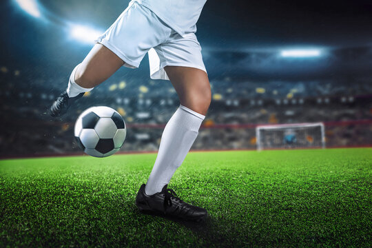 Soccer player in action on sport stadium background
