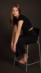 Fototapeta premium person sitting on chair