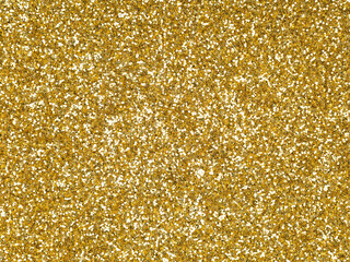 Gold glitter texture closeup. Saturated shiny holographic background for Christmas desktop, holiday...