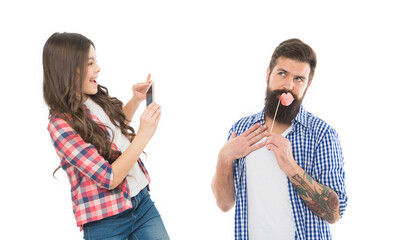 Settings of camera. Application for editing photo. Happy little girl hold smartphone or mobile...