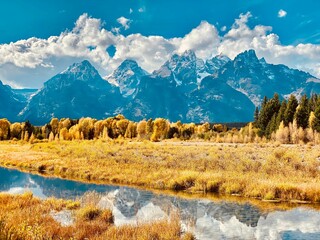 Beautiful landscape of Yellowstone national park captured in fall colors against mountains skyline