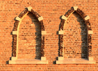 red brick wall with windows