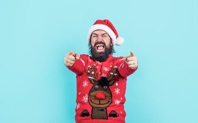 bearded santa man in hat smiling while prepare for celebrating happy new year party and christmas...