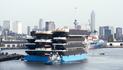 Rotterdam, the Netherlands - 10 29 2022: Heavy load carrier with cargo of inland barges on board arrived from China © I am from Mykolayiv