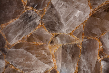 Brown smoky quartz stone slab. Gemstone background. Matt natural semi precious mineral pattern....