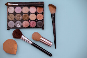 Selection of brushes and makeup shot from above