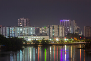 Fototapeta na wymiar Saigon, Vietnam - Jun 21, 2021 - Impression landscape of Ho Chi Minh city at night , Saigon river flows through the city