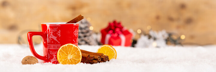 Mulled spiced wine or hot tea Christmas time decoration in winter copyspace copy space banner...