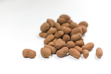 brown pebbles expanded clay lie on a white background in a pile