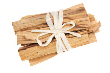 Palo Santo sticks – holy wood (Bursera graveolens), a tree species native to South America, used for incense, aromatic oil, and indigenous medicine. Isolated on white background. Close up, top view