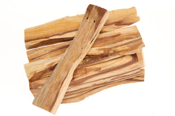 Palo Santo sticks – holy wood (Bursera graveolens), a tree species native to South America, used for incense, aromatic oil, and indigenous medicine. Isolated on white background. Close up, top view