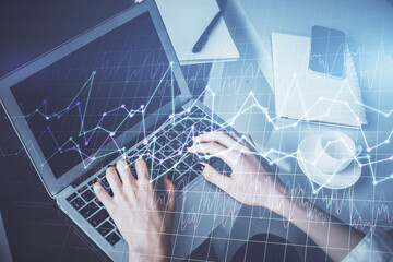 Double exposure of woman hands typing on computer and forex chart hologram drawing. Stock market invest concept.