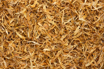 Dried marigold petals (Calendula officinalis). Marigolds have been cultivated and used as a medicinal plant since the Middle Ages. Close up, top view.