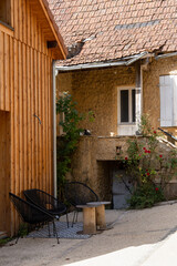 traditional stone built french dwelling with wooden window shutters