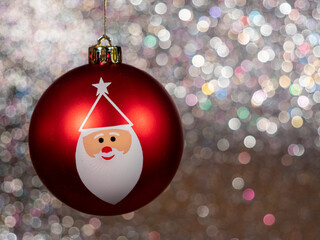 Christmas balls on a silvery background. Christmas decoration with beautiful bokeh.
