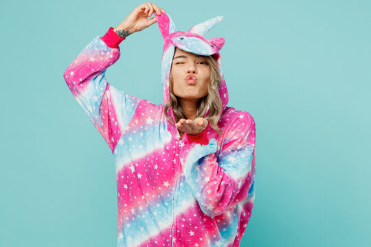 Young Woman Wear Domestic Costume With Hoody Hold Animals Ears Sending Blow Air Kiss Look Camera Invite For Pajama Party Isolated On Plain Pastel Light Blue Cyan Background. People Lifestyle Concept.